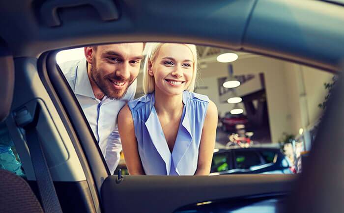 Couple Buying Cars